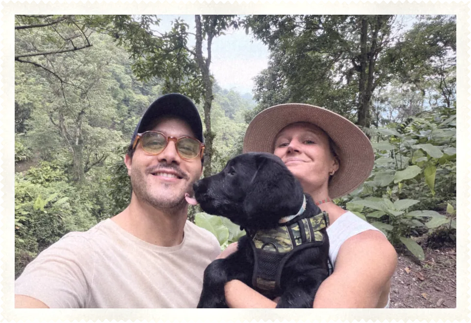 Katie and Carlos in the jungle with their puppy, Bondi